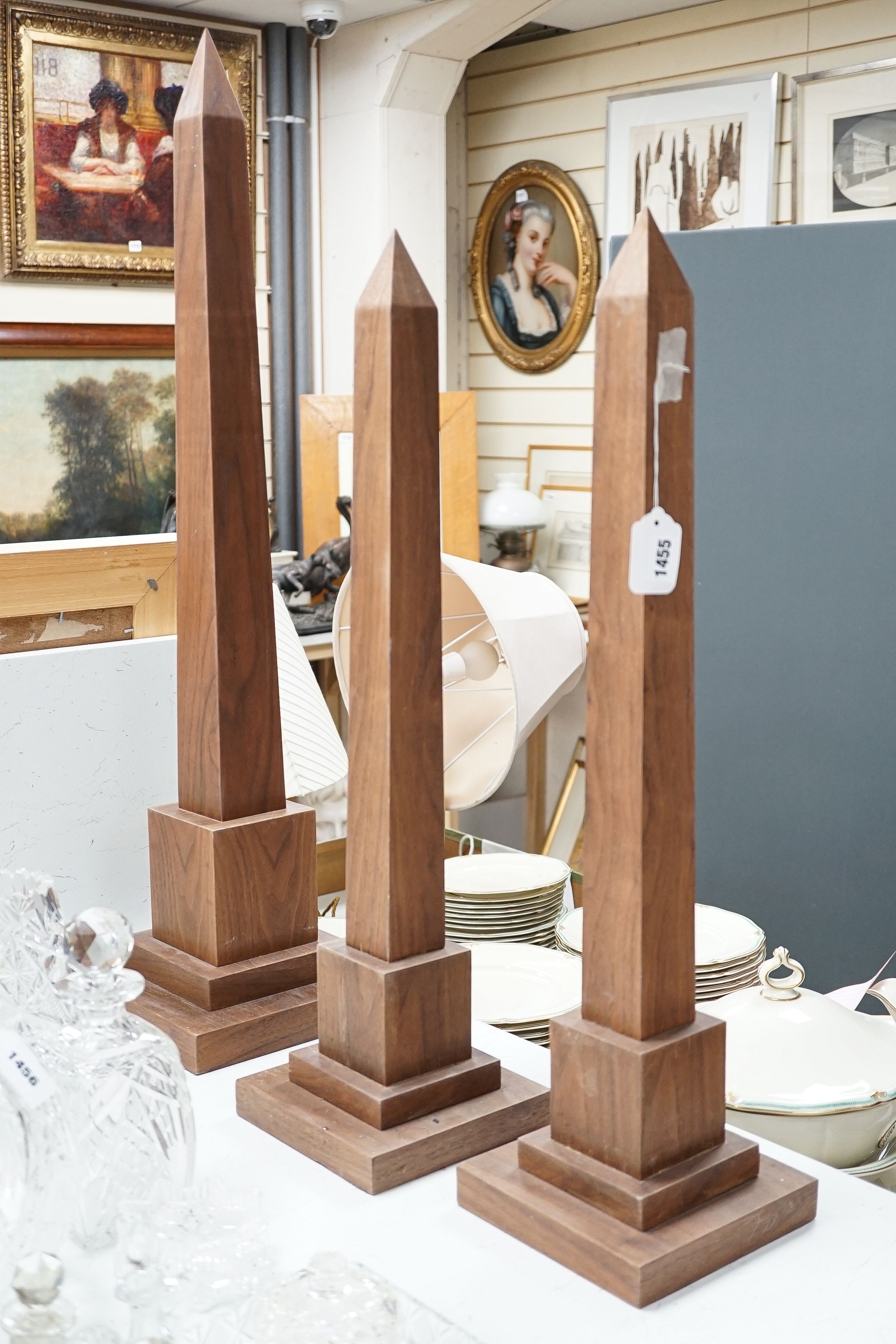 A large pair of contemporary hardwood obelisks, plus two others located throughout the property